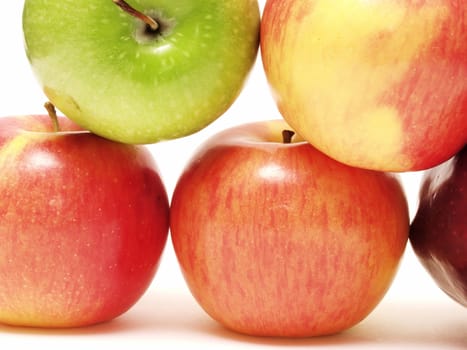 A group of five apples isolated on a white background