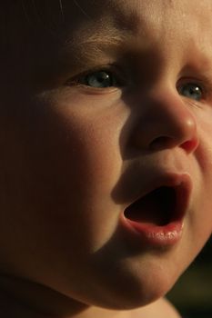 baby singing in the sun.