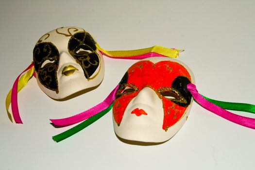 Colorful Theatre Masks with ribbons isolated on a white background.
