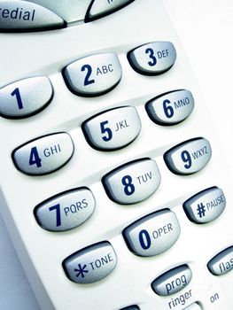 Close up view of a cordless phone, showing numerical keypad.