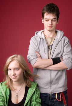 The young girl and the guy on a red background.