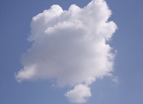 View of the single cloud on a clear sunny day.
