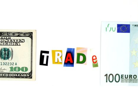 Conceptual photo of European and American currency and word "trade" made of magazine clippings.