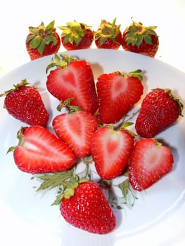 a few strawberries on a dish