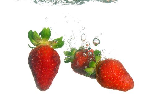 Splash of fresh strawberry to water with bubbles of air