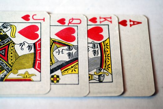 The King, Queen, Jack and Ace of the Hearts suit from a deck of playing cards