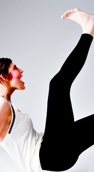 Studio portrait of a tall brunette with extreme make-up on