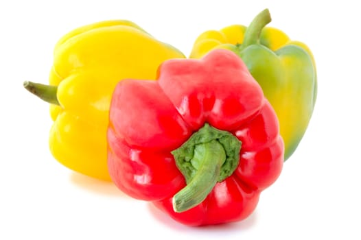 Three peppers (paprika) - red and yellow-green vegetables on overwhite background.