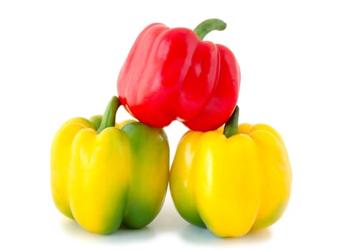 Three peppers (paprika) - red and yellow-green vegetables on overwhite background.