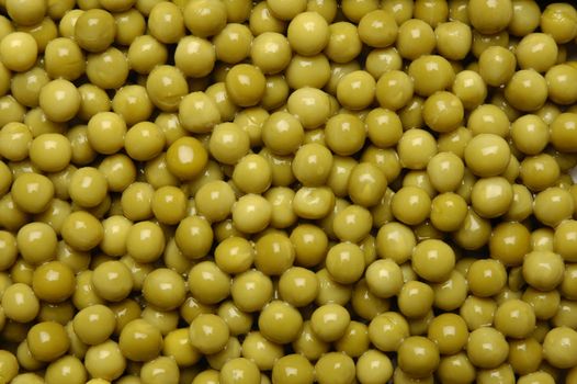 canned green peas is distributed on a plane in a complete shot