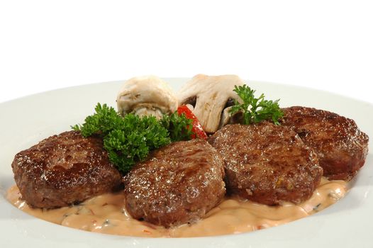 four cutlets with champignons