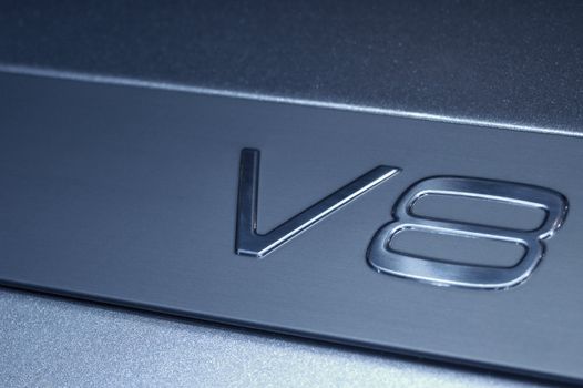 The sign of a big, powerful engine, eight cylinders arranged in the 'V' configuration. This symbol is embossed on the top cover of a Volvo engine.