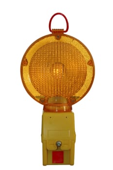 A flashing warning lantern for roadworks, caught just as it flashes bright amber. Isolated on white with a clipping path included.