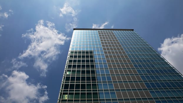 skyscraper office building in Tokyo Japan with blue sky background