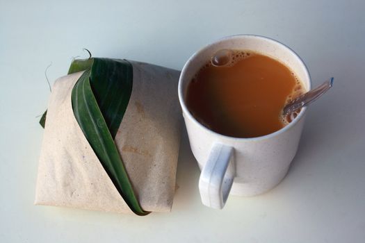 Popular Malaysia food rice with coconut milk and a cup of milk tea. These are common breakfast in Malaysia and Singapore.