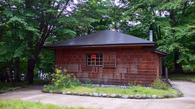 wooden summer house in the forest