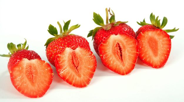 Ripe berries of a strawberry on a white sheet