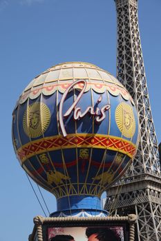 The famous globe and Eiffel Tower of the Paris Hotel on the strip attracts tourists and gamblers