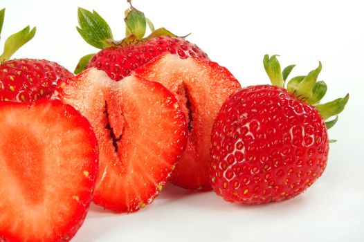 Ripe berries of a strawberry on a white sheet