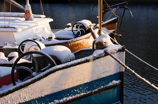 Part of old iron ship in winter snow - horizontal image