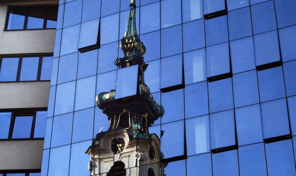 Churchs reflection in a modern hotel in Vienna