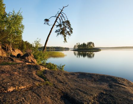 Russia, Vyborg, the Vyborg gulf. A landscape with a water table early in the morning