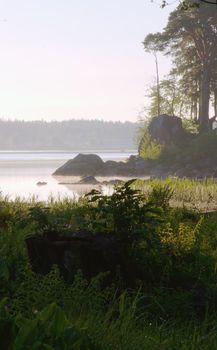 Russia, Vyborg, the Vyborg gulf. A landscape with a water table early in the morning