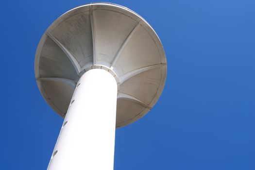 White lighthouse in Istanbul over blue sky