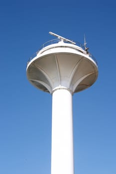 White lighthouse in Istanbul over blue sky