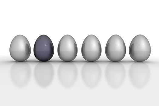 six metallic eggs ordered in a line on a refelctive white ground - five eggs grey, one egg black