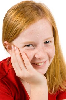 portrait of an adorable young girl with her hand on cheek on white background 