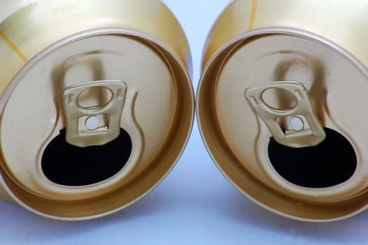 two gold cans isolated on the background