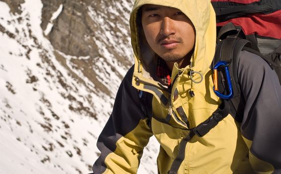 Portrait of Asian mountaineer man with tired face.