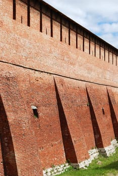 Partly reconstructed brick wall of old fortress in Kolomna town near Moscow, Russia (vertical version)