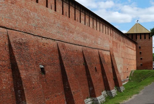 Partly reconstructed brick wall and tower of old fortress in Kolomna town near Moscow, Russia (horizontal version)