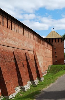 Partly reconstructed brick wall and tower of old fortress in Kolomna town near Moscow, Russia (vertical version)