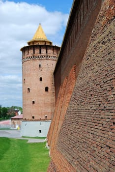 Partly reconstructed brick wall and tower of old fortress in Kolomna town near Moscow, Russia (vertical version)