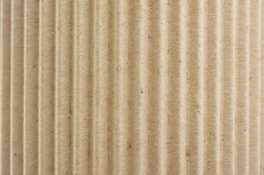 Rounded Corrugated Cardboard Background with Narrow Depth of Field.