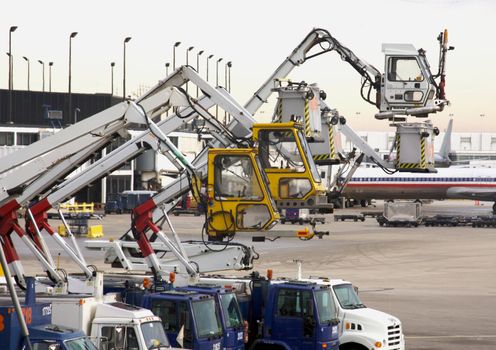 Deicing Equipment Ready at an Airport During A Blustry Winter Day