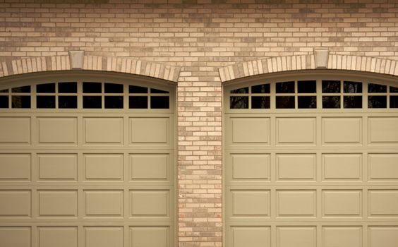 Abstract of Modern Home Brick and Garage Doors