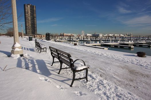 Empty Snowy Bench in Chicago After Winter Snow Along Lake Shore Drive.