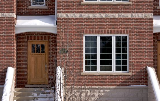 Modern Apartment Facade on a Snowy Winter Day