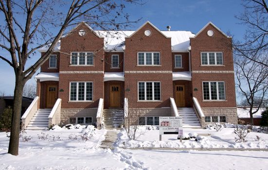 Modern Townhome Facade on a Snowy Winter Day