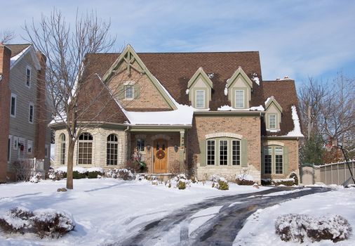 Majestic Newly Constructed Home Facade on a Blustry Day