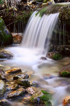 Closeup of a small waterfall, taken with a long exposure