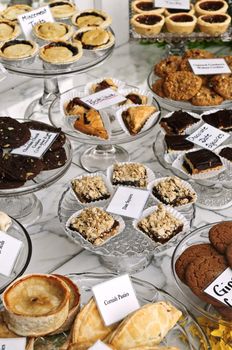 Various desserts on display in bakery window