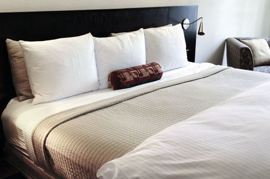 Bedroom with comfortable bed in neutral colors