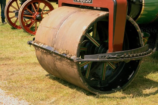 Heavy front wheel of an old steam roller