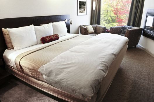 Bedroom with comfortable bed in neutral colors