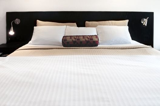Comfortable bed in upscale hotel close up